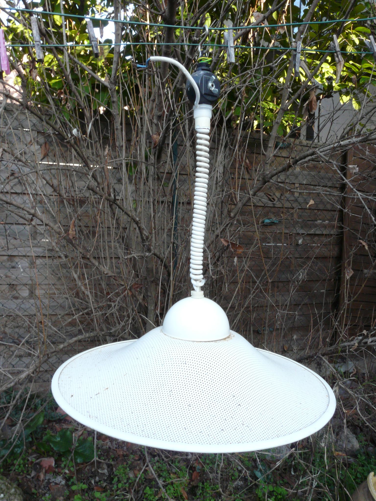 White perforated sheet metal chandelier