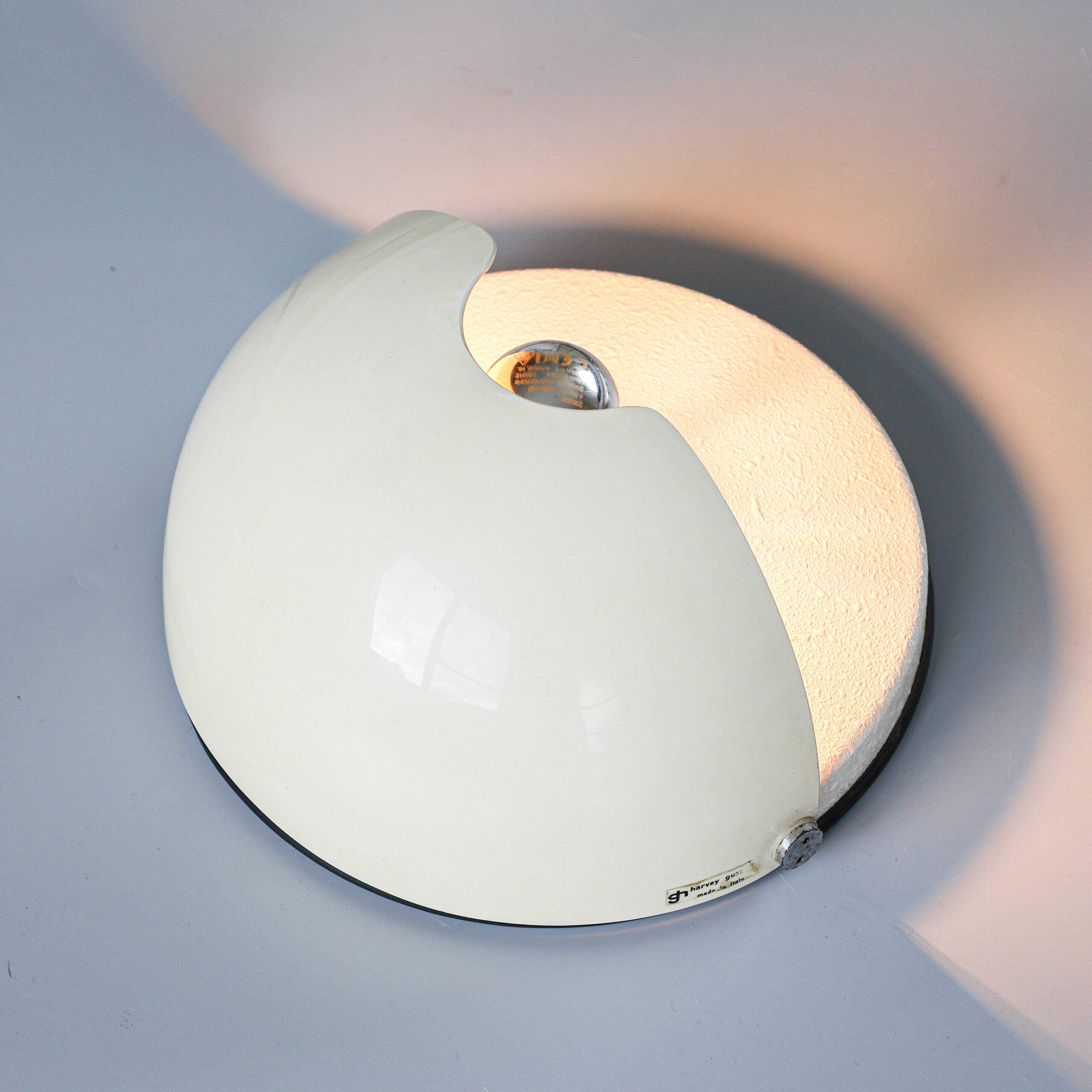 Vintage Harvey Guzzini 'Mezzanotte' sconce, 1970s.