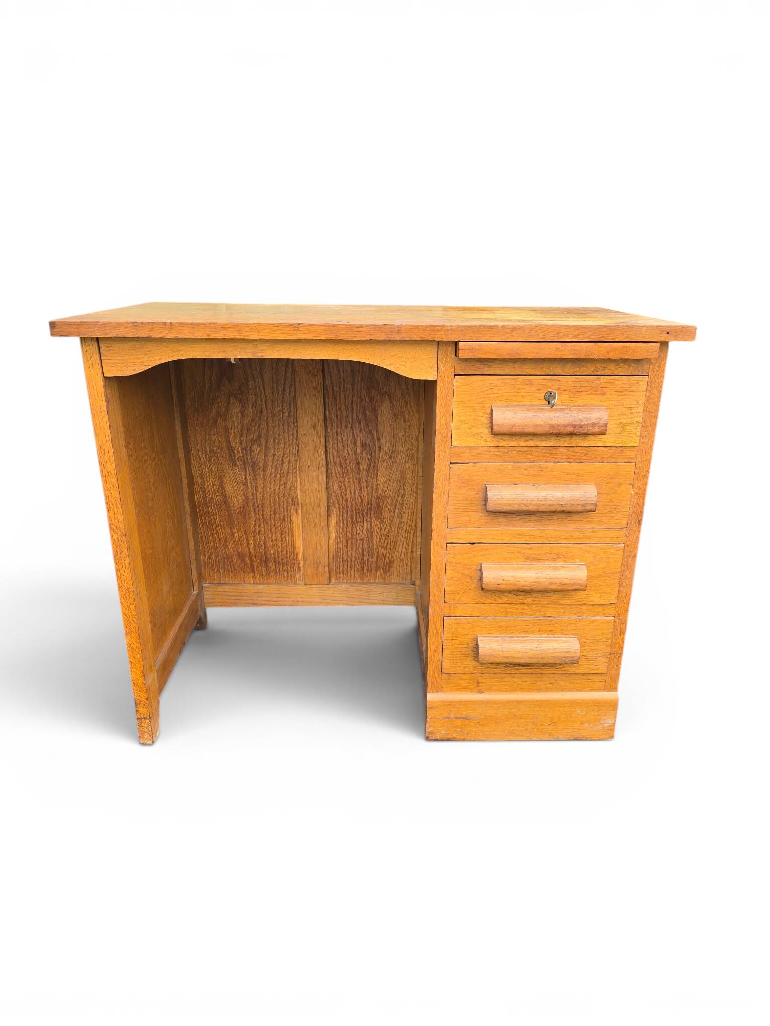 Vintage oak desk with a drawer unit and sliding shelf.