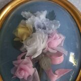 Silk flower frame under curved glass