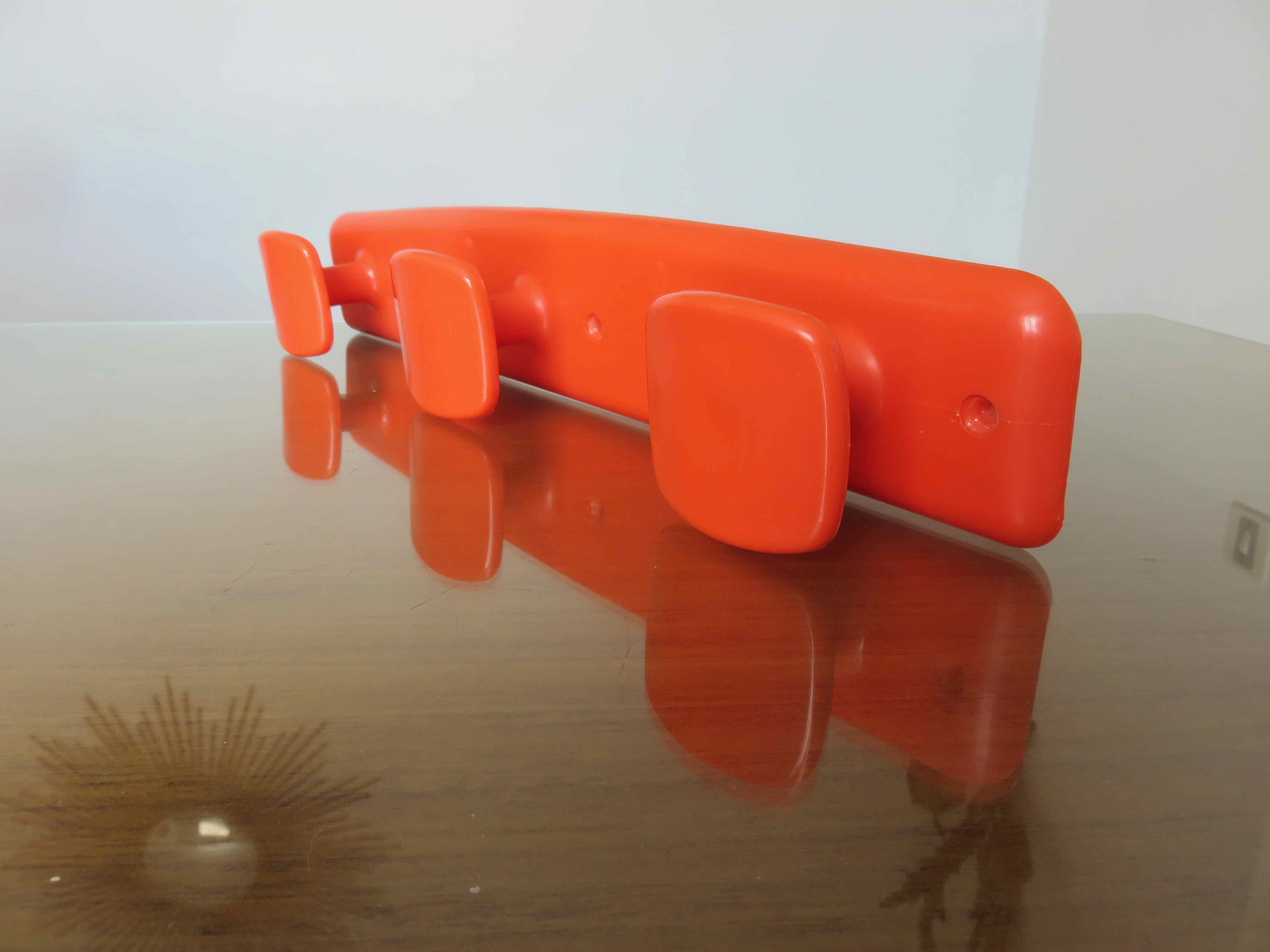 Orange plastic wall coat rack "syla" france 1970
