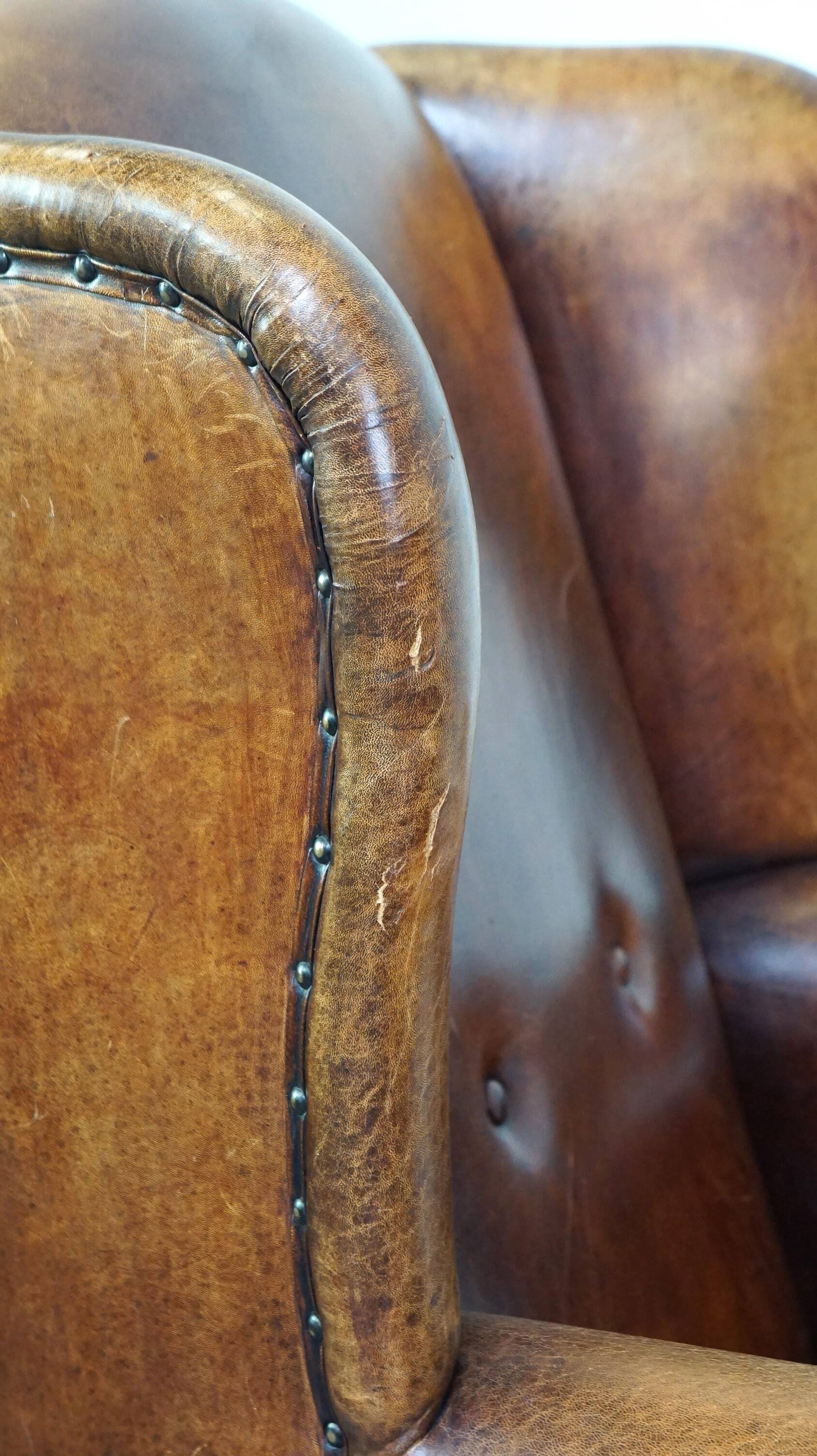 Sheepskin leather chair with a beautiful patina