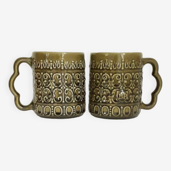 Duo of BP 70's slip mugs