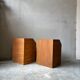 Pair of handcrafted solid wood bedside tables with drop-down doors.