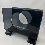 Vintage 1970s smoked plexiglass magazine rack, minimalist design.