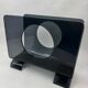 Vintage 1970s smoked plexiglass magazine rack, minimalist design.