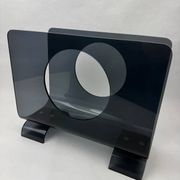Vintage 1970s smoked plexiglass magazine rack, minimalist design.