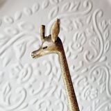 Stylized brass giraffes