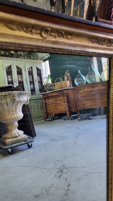 GOLDEN WOODEN MIRROR WITH PALMETTES FROM THE 19TH CENTURY