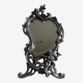 Old silvered bronze mirror cherub psyche