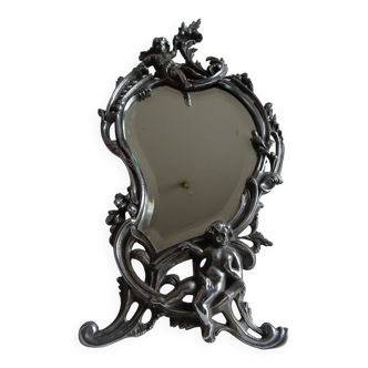 Old silvered bronze mirror cherub psyche