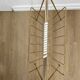 Vintage magazine rack in gold metal with white plastic handle. 60s.
