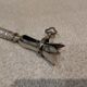 Silver metal handle in the style of Louis XVI.
