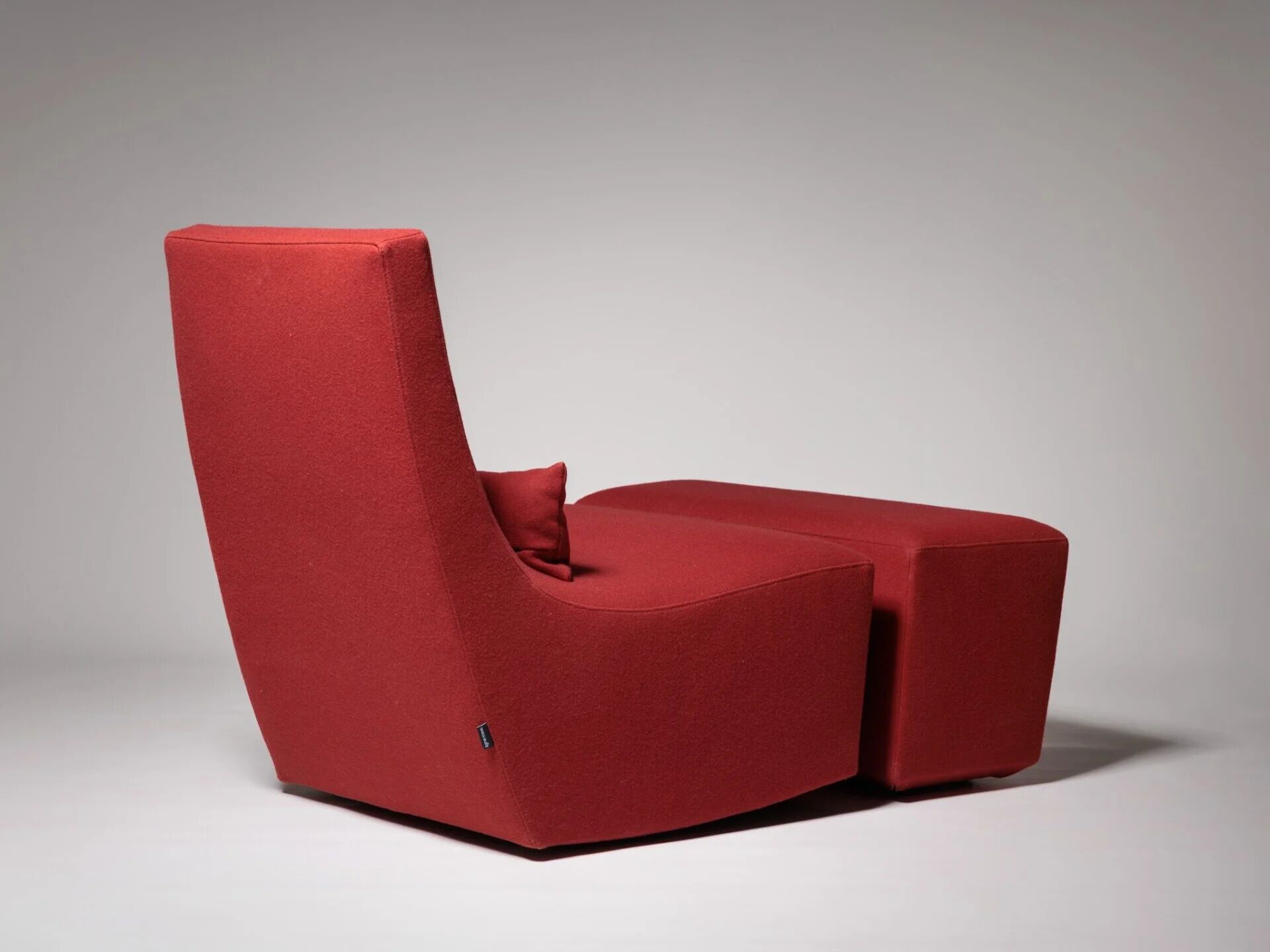 Rocking chair and footstool in red wool by Ligne Roset, France
