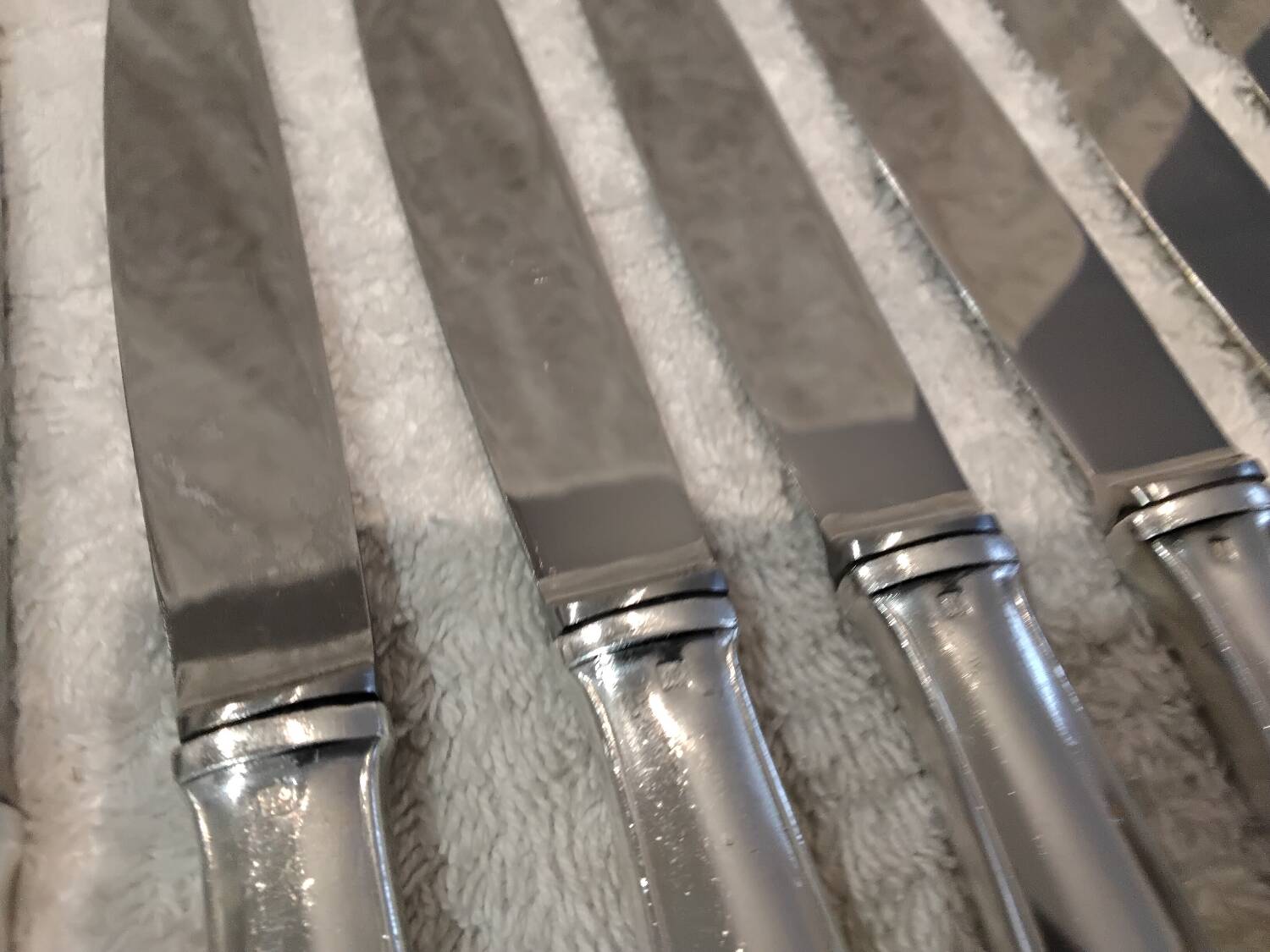 12 silver-plated dessert knives by Platil, rocaille style