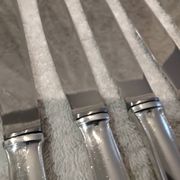 12 silver-plated dessert knives by Platil, rocaille style