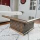 Square table in woven chestnut, with glass top