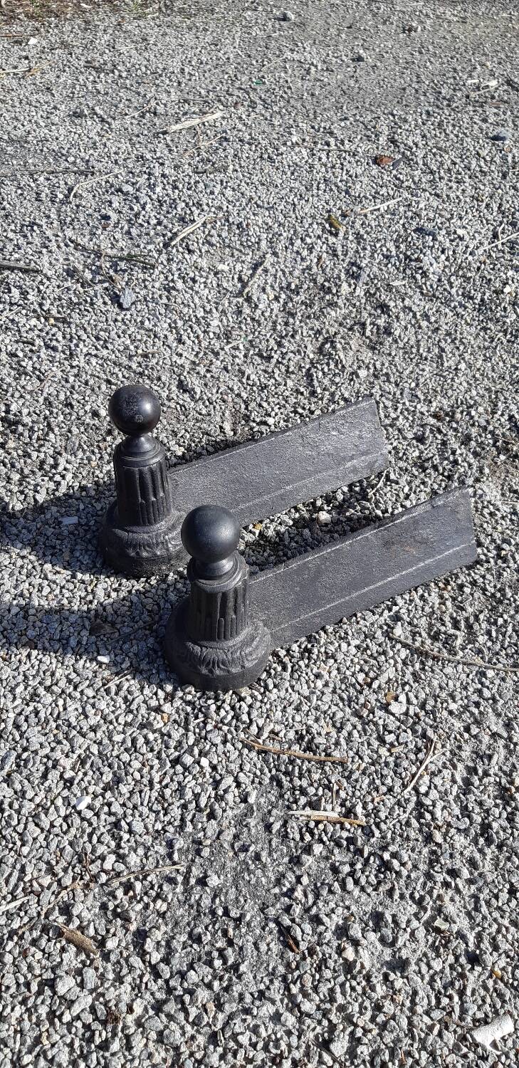 Pair of neo-classical cast iron fireplace headboards