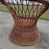 Old throne basket armchair in woven wicker