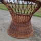 Old throne basket armchair in woven wicker