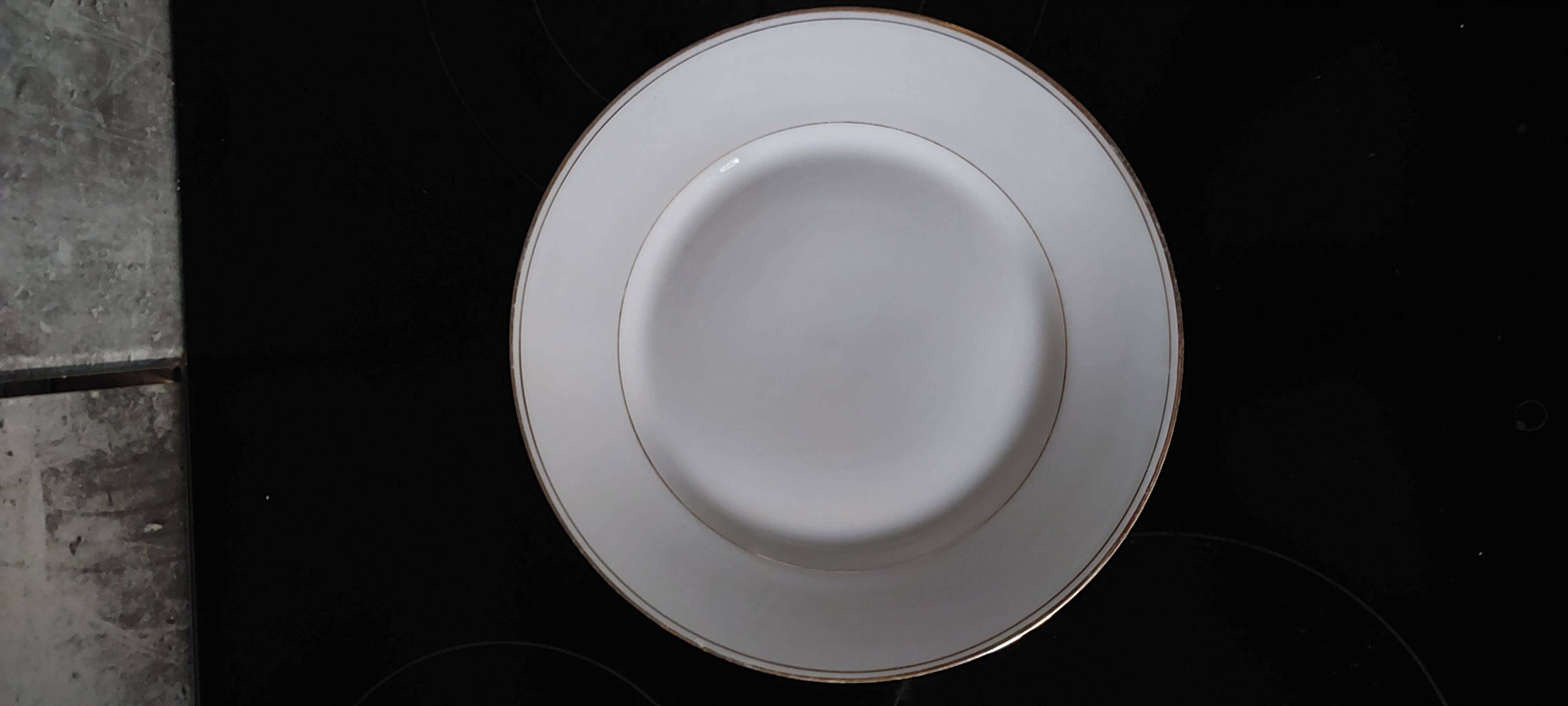 White and gold Limoges plates