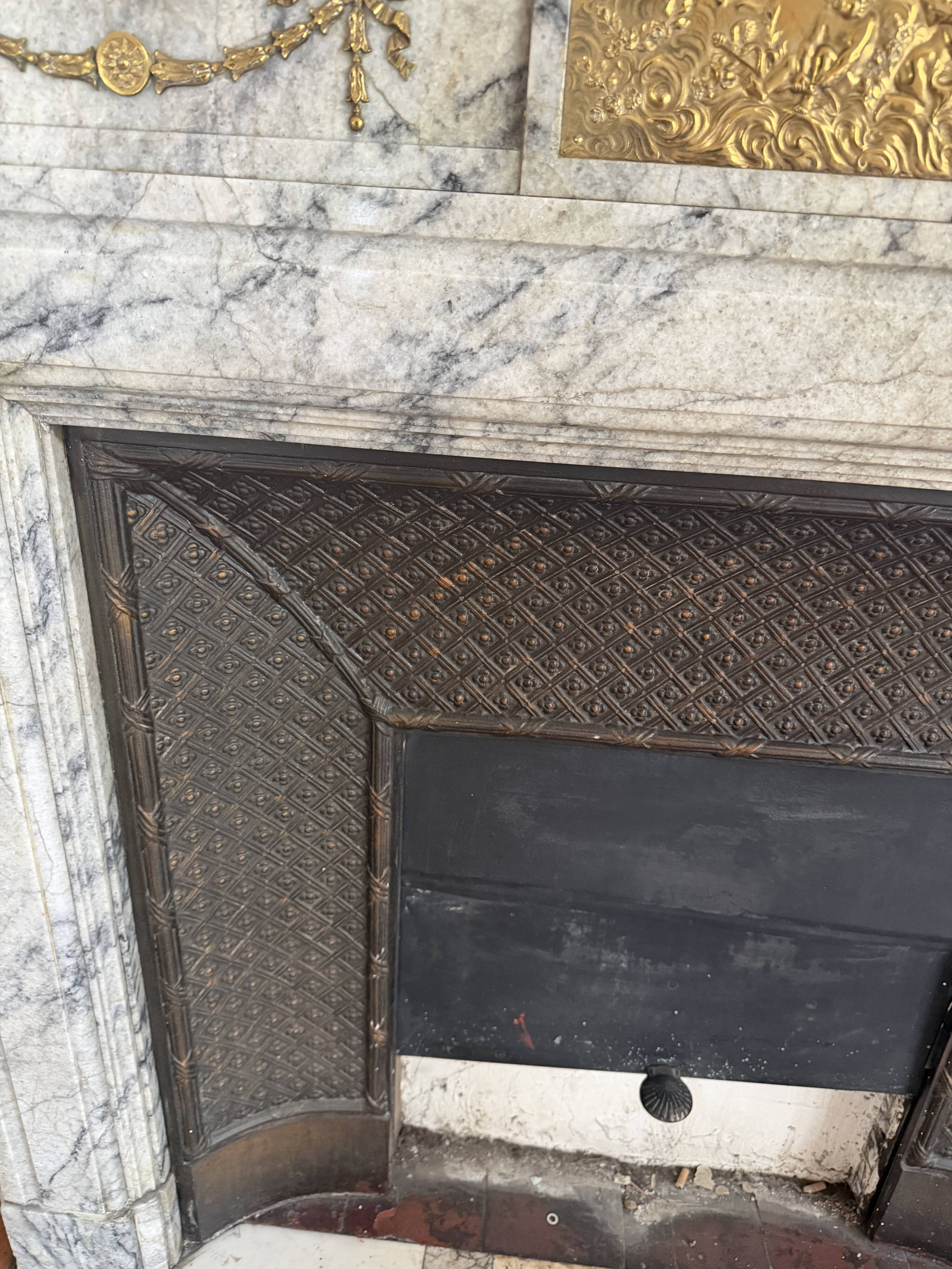 Louis XVI fireplace in veined grey marble with original gilded bronzes from the 19th century.