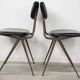 Pair of industrial style chairs in metal and faux black leather