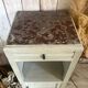 White patinated bedside table with a marble top