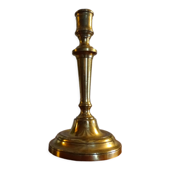 Old brass candle holder and its candle 21.5 cm