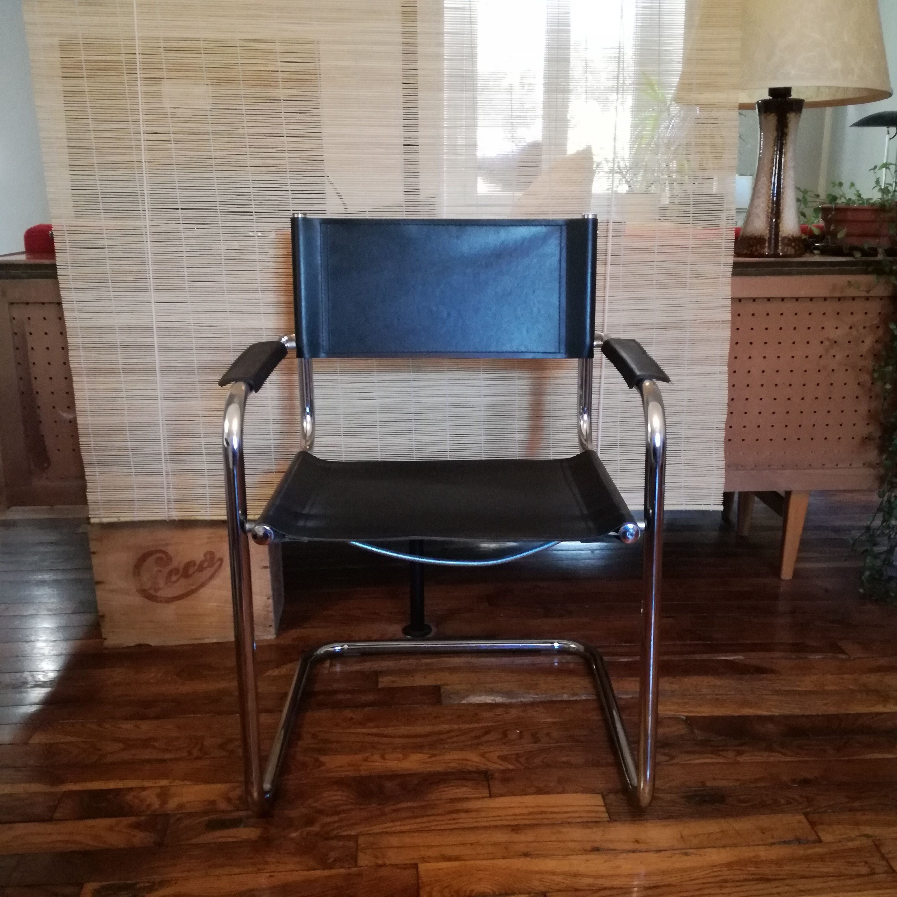 Black leather cantilever armchair