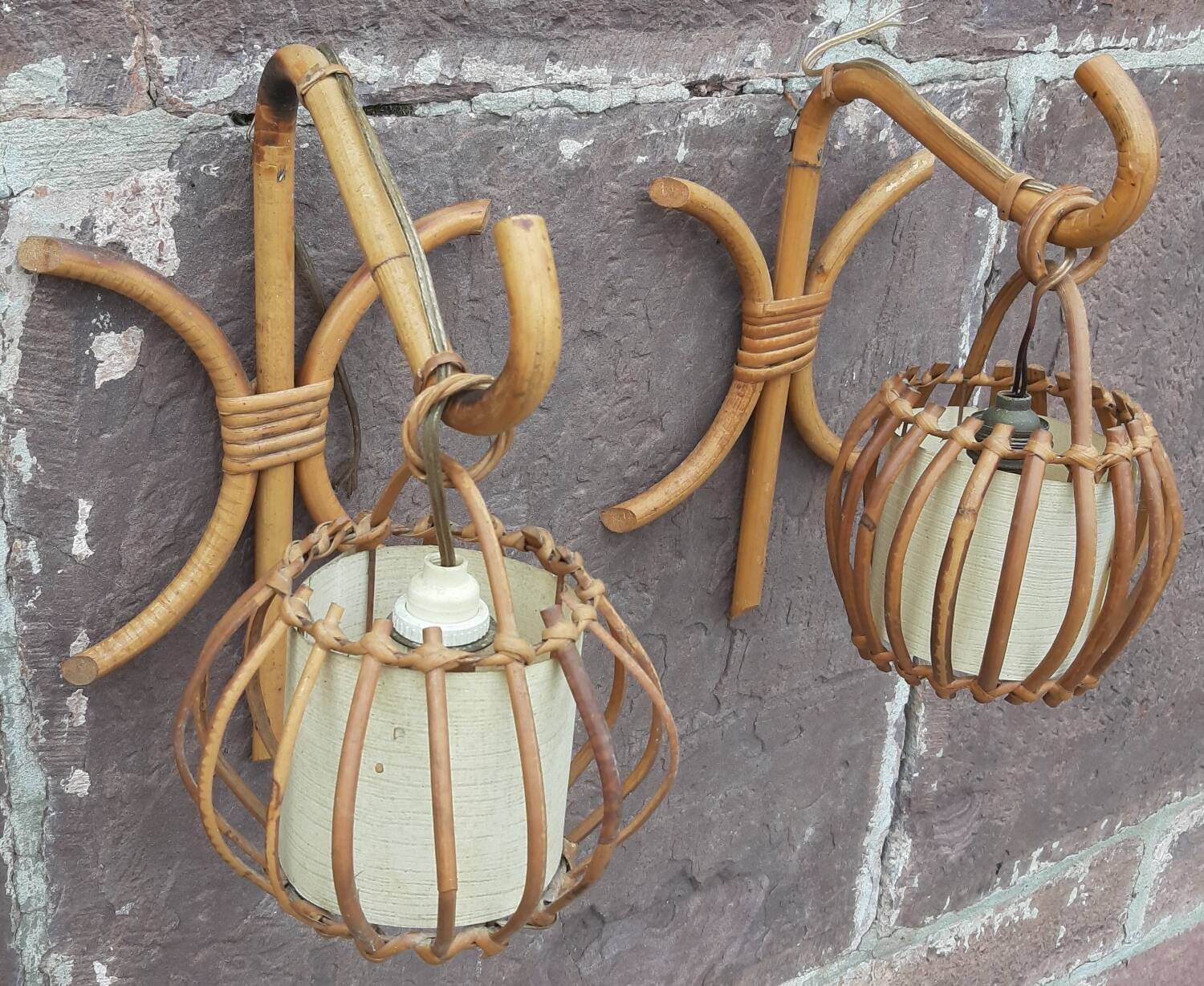 Pair of Louis Sognot rattan wall lights.