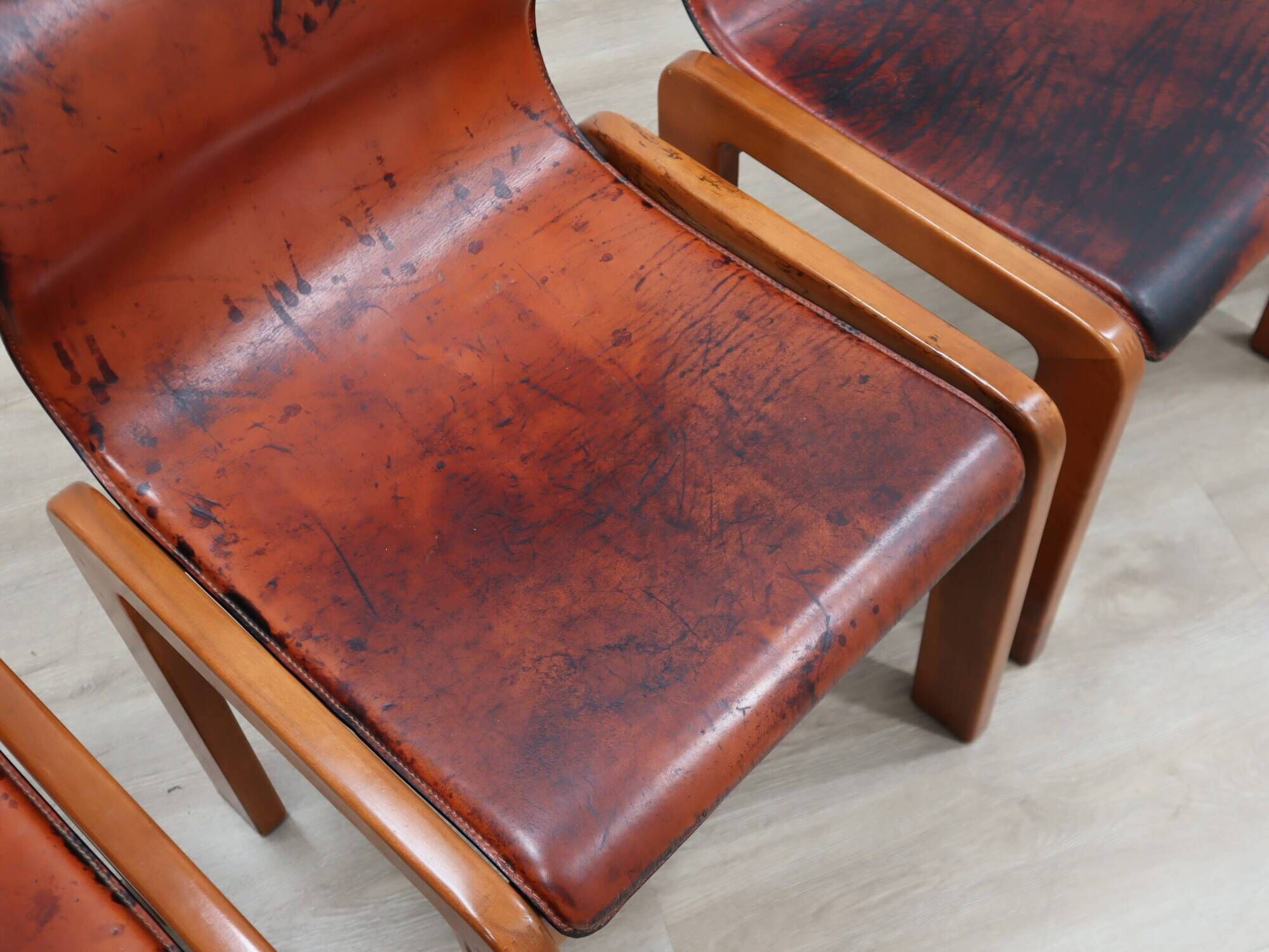 Curved wooden and leather chairs by Afra and Tobia Scarpa from the 1970s, set of 4.