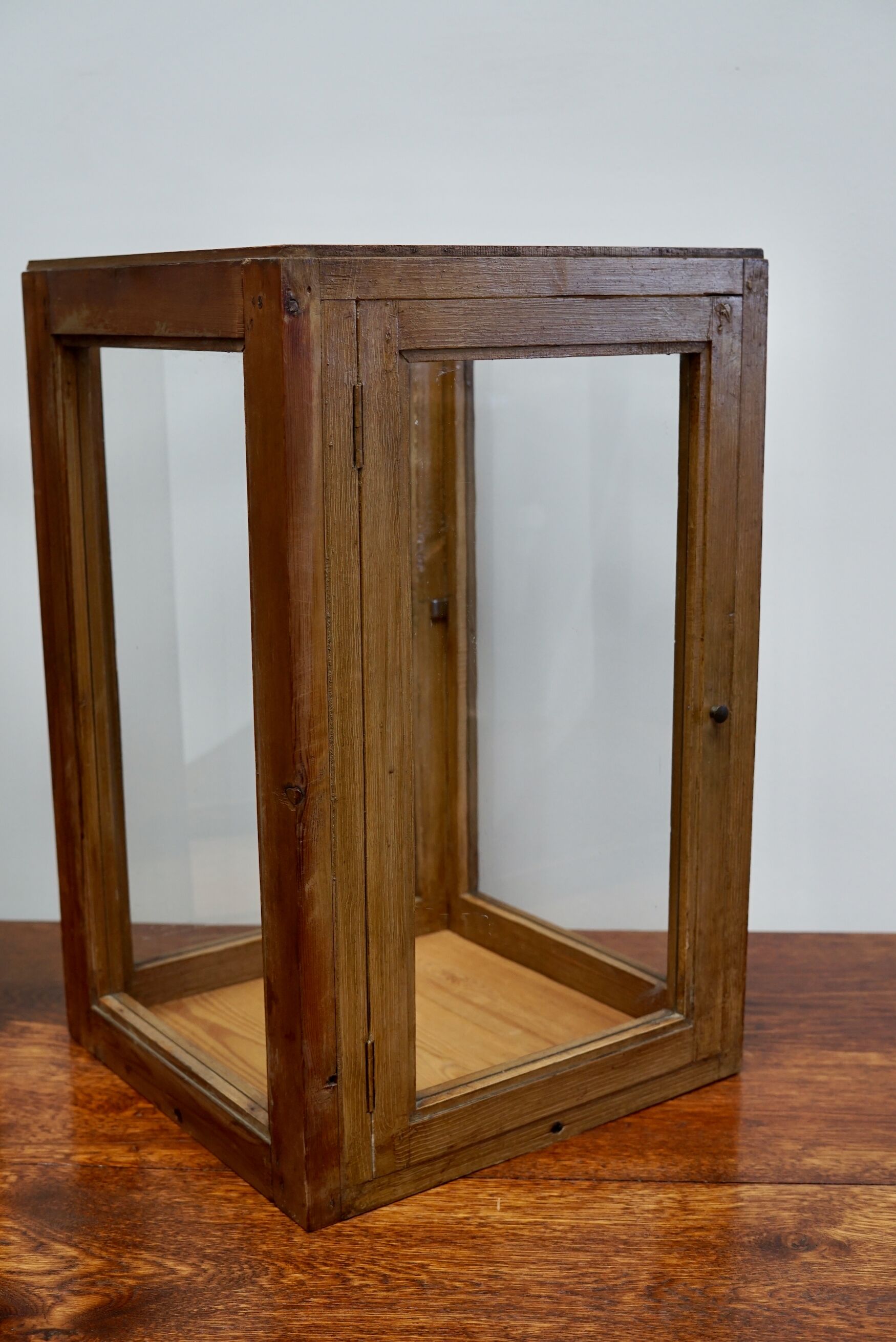 pair of faux oak shop display cabinets, circa 1920s