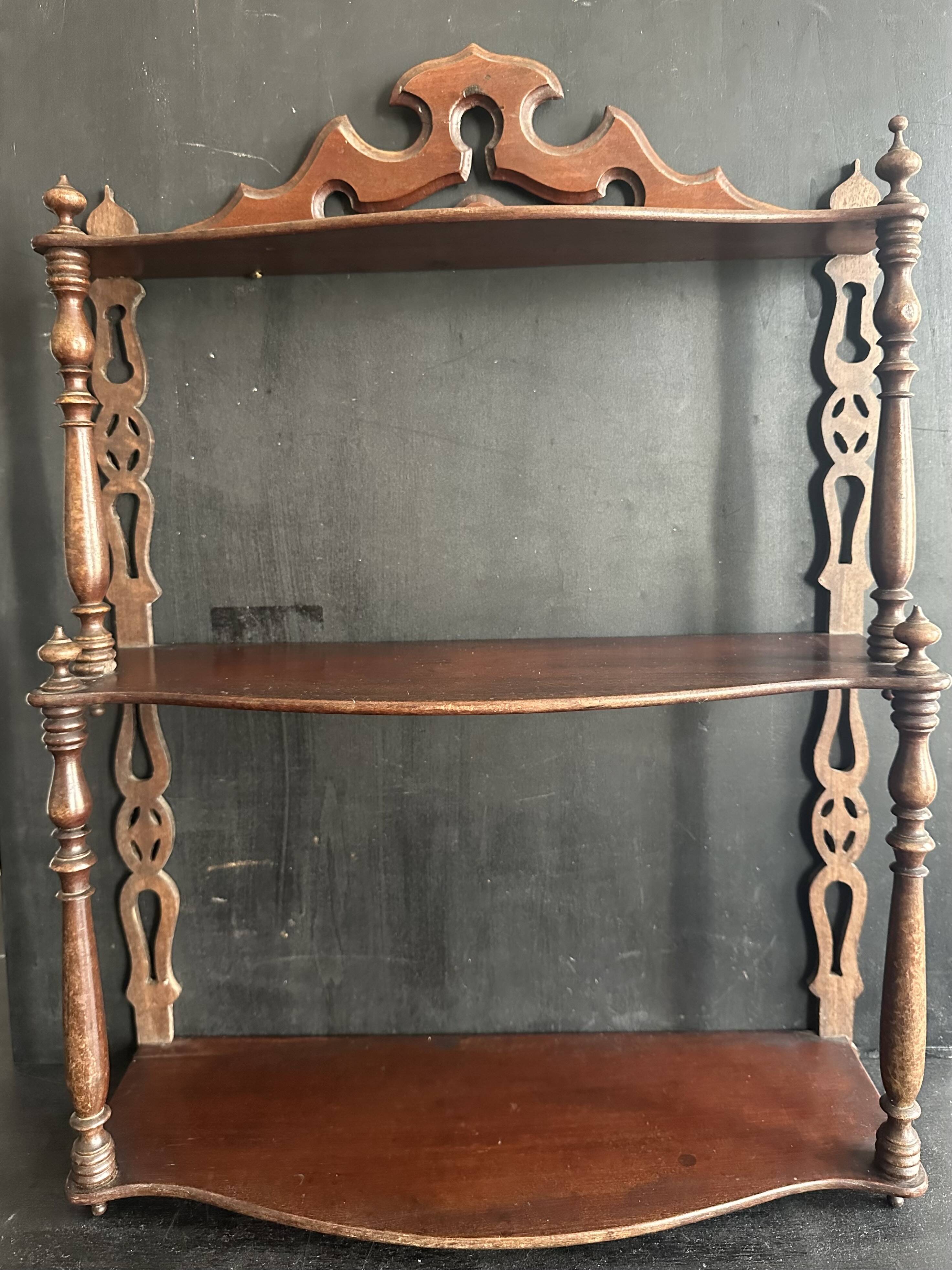 Napoleon III wall shelf in turned wood with a pediment.