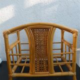Wicker rattan magazine rack with vintage caning