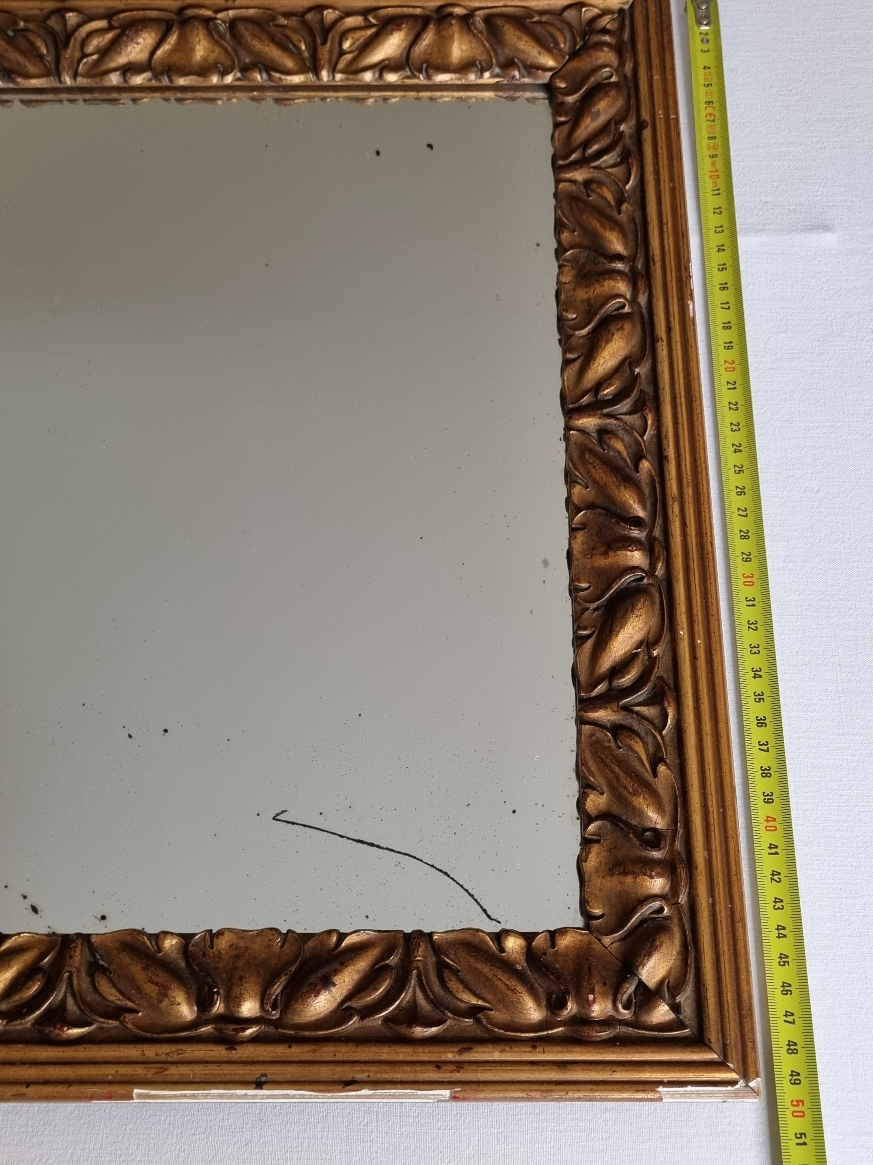 Patinated golden rectangular mirror, decorated with acanthus leaves, 49 cm