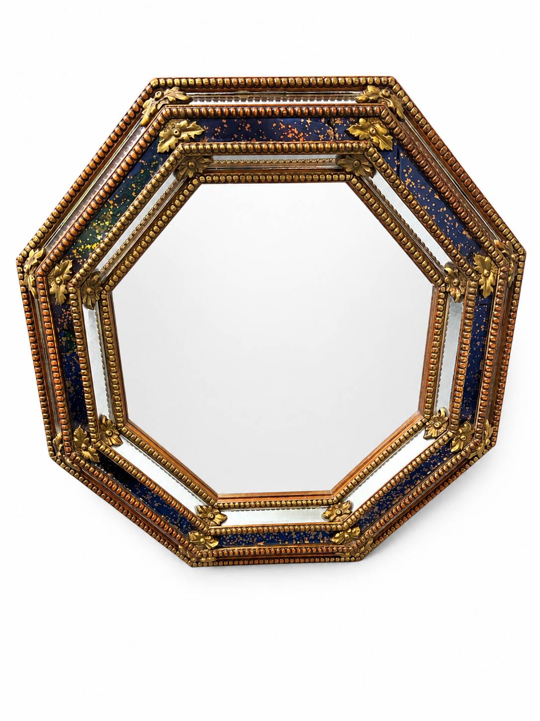 Octagonal wall mirror in cobalt blue eglomisé glass and gilded wood, Spain.