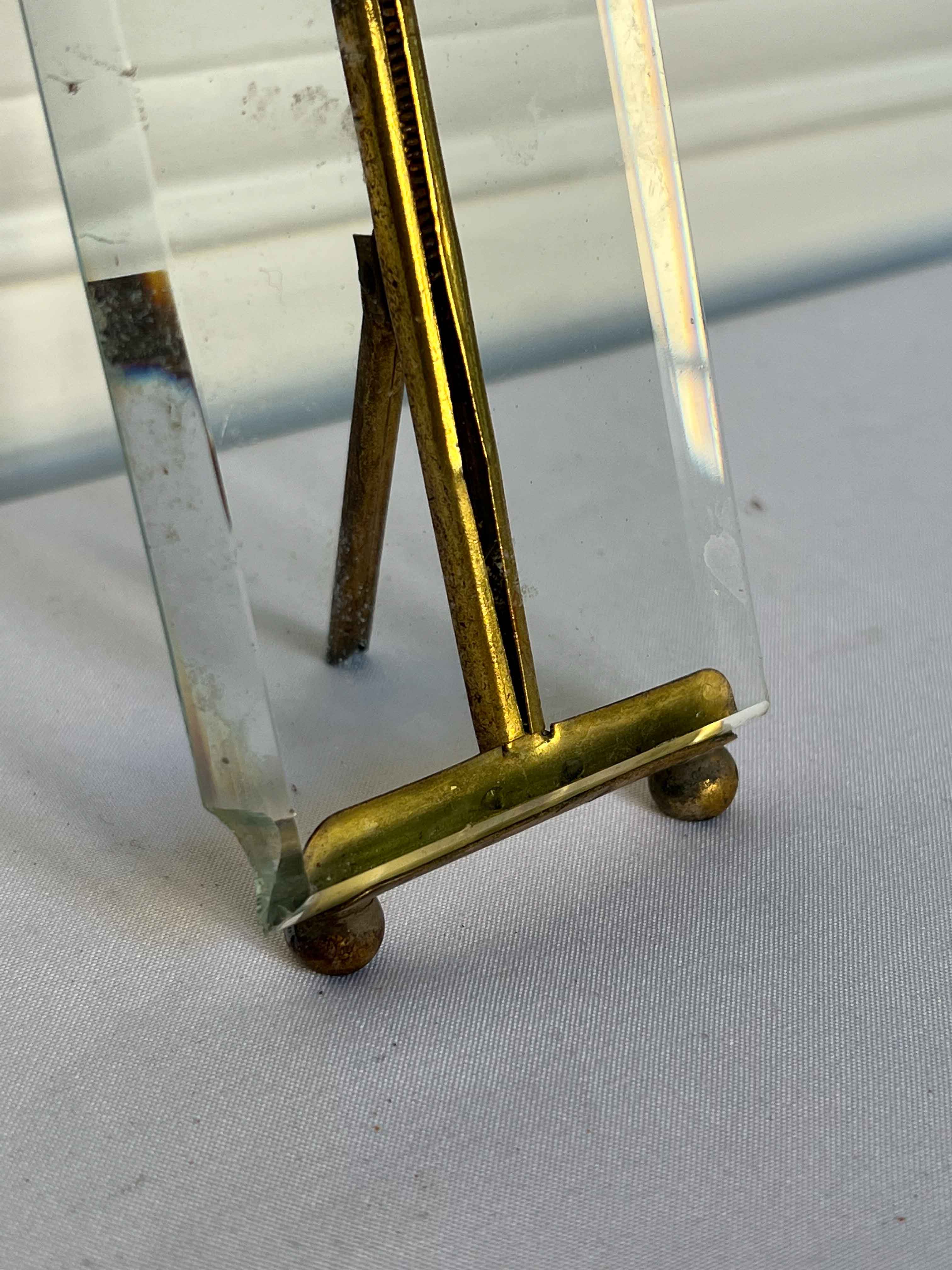 Frame in brass and beveled glass