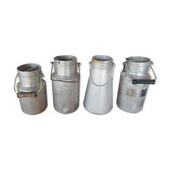 Set of 4 old metal milk canister jars