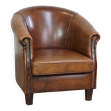Subtle, neat sheepskin leather club armchair with a fixed seat cushion in a deep, dark cognac color