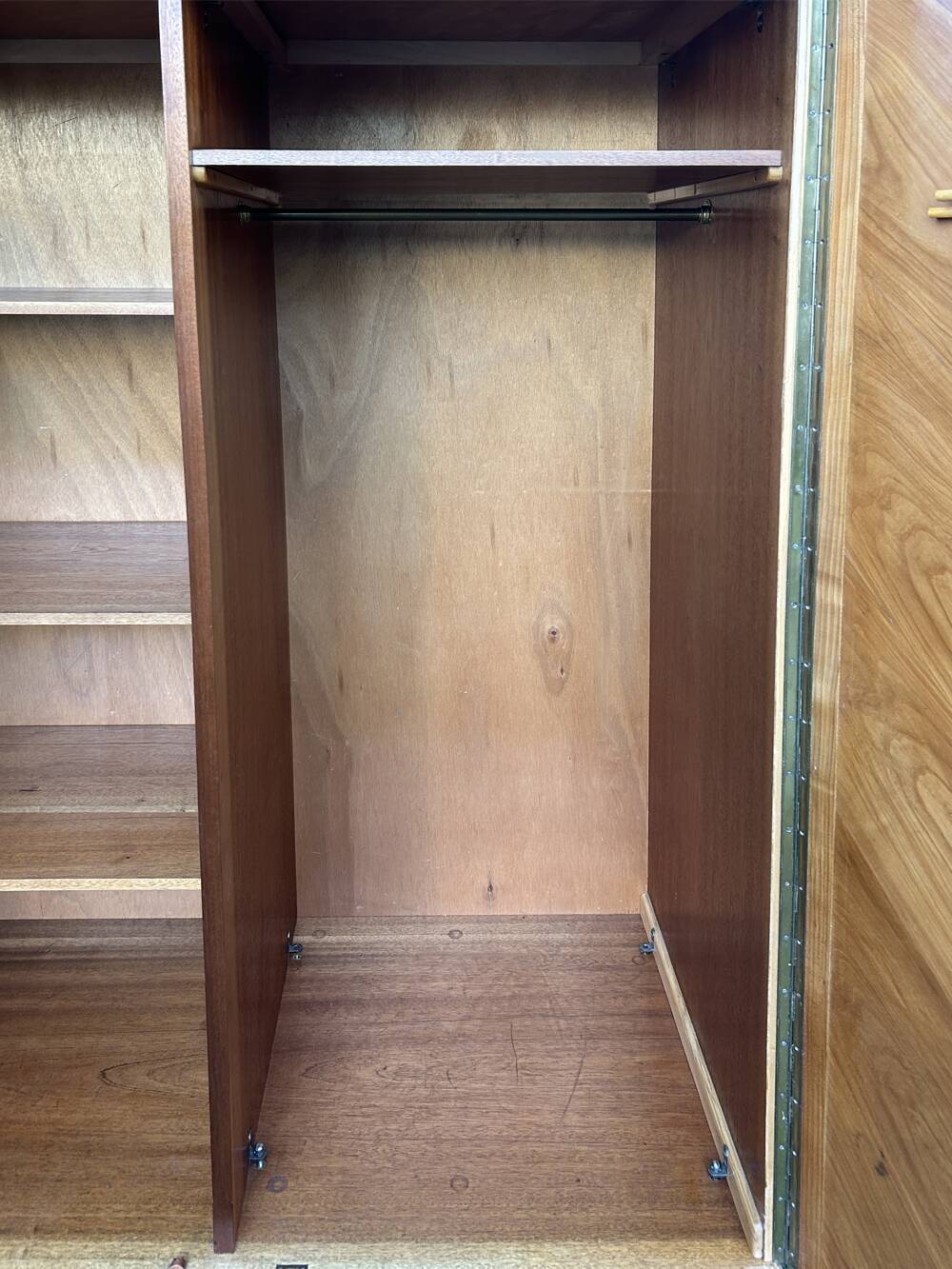Mid-century wardrobe from the 1960s in wood, with a chevron front and tapered legs.