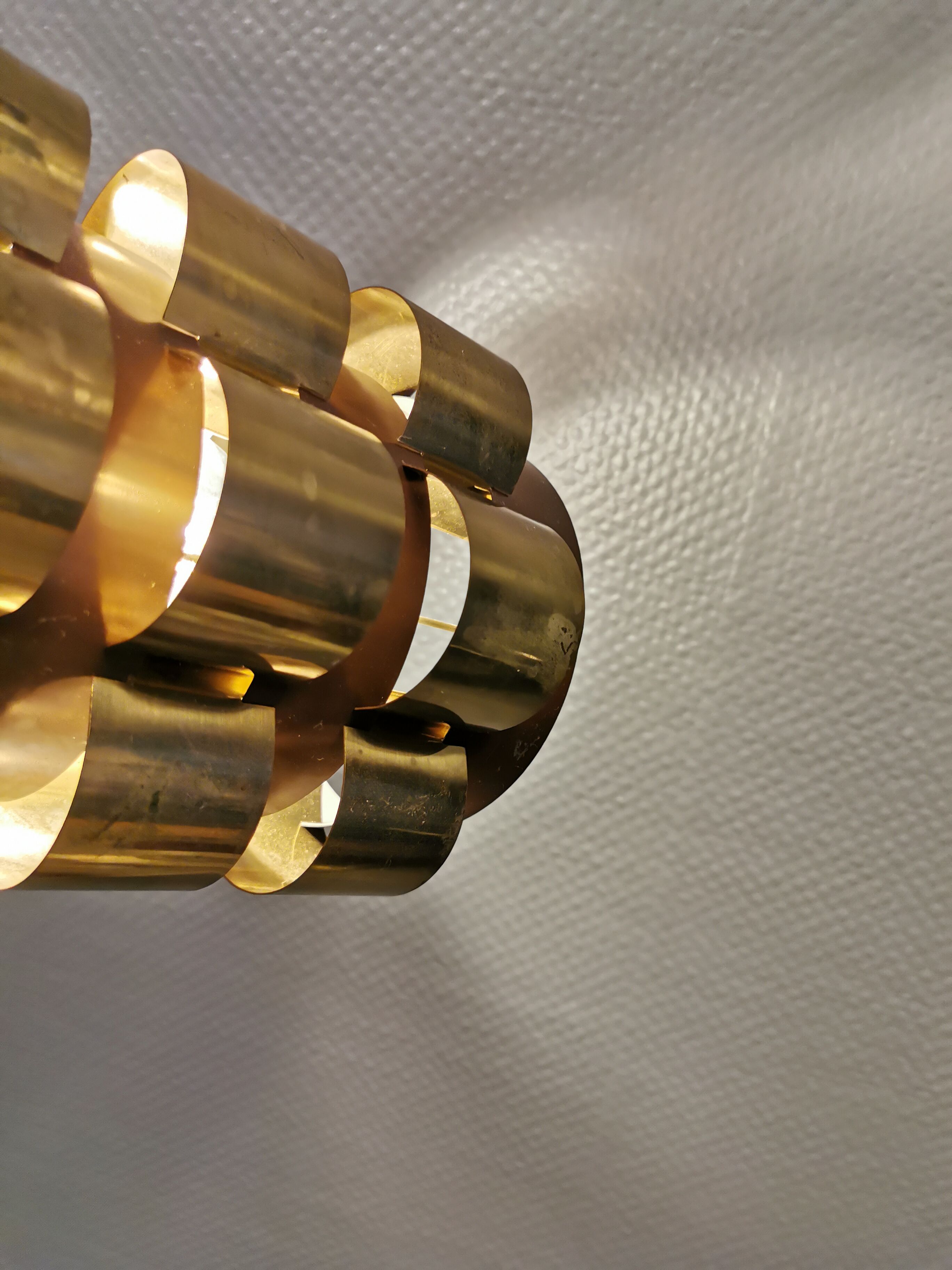 Danish hanging lamp from the 70s, in thin cut metal.