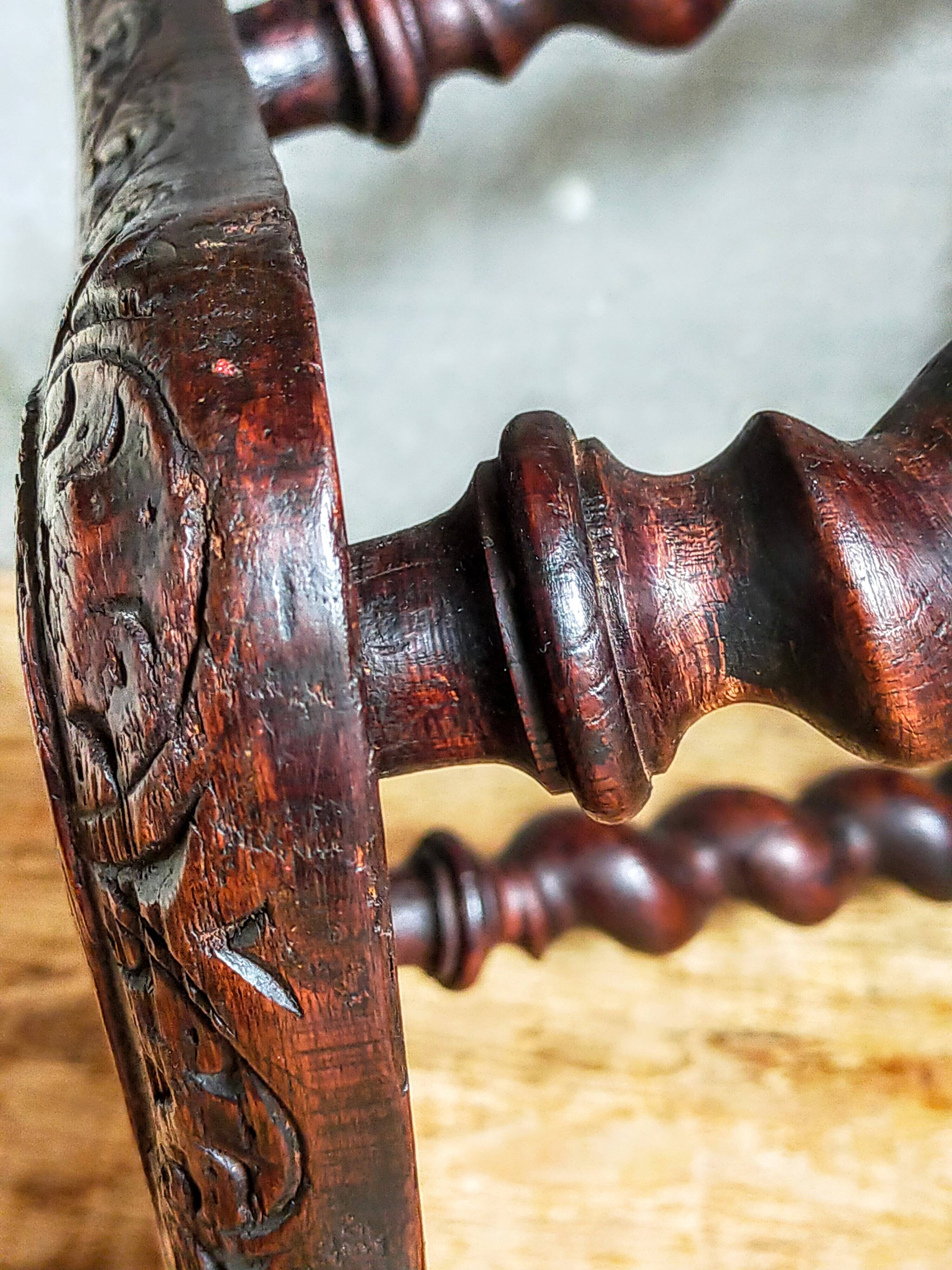 Antique stool in turned and carved solid wood