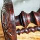 Antique stool in turned and carved solid wood