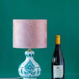 Royal Delft blue-green ceramic table lamp with pink jacquard peacock shade.