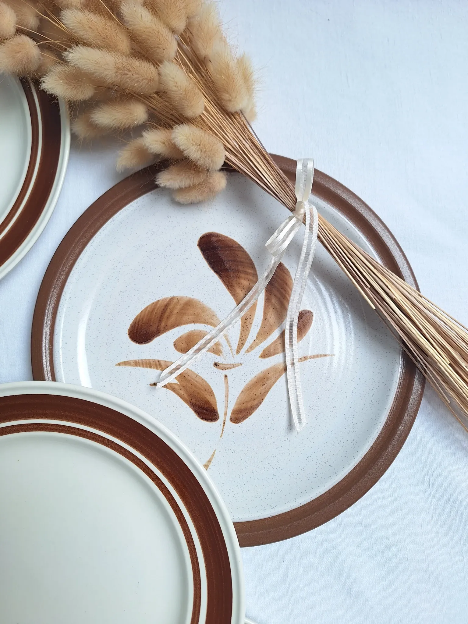Brown flower-patterned plates from the 1970s.