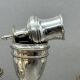 Pair of silver-plated metal candelabra decorated with hunting horns