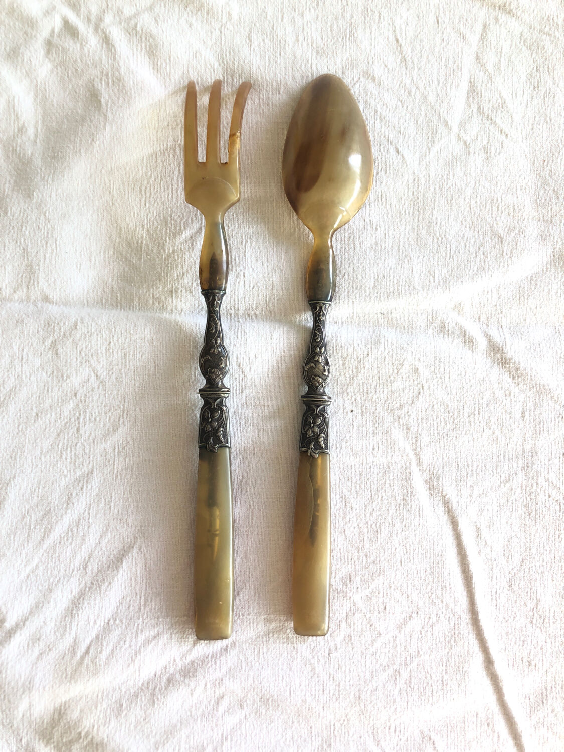 Old corn and silver salad cutlery