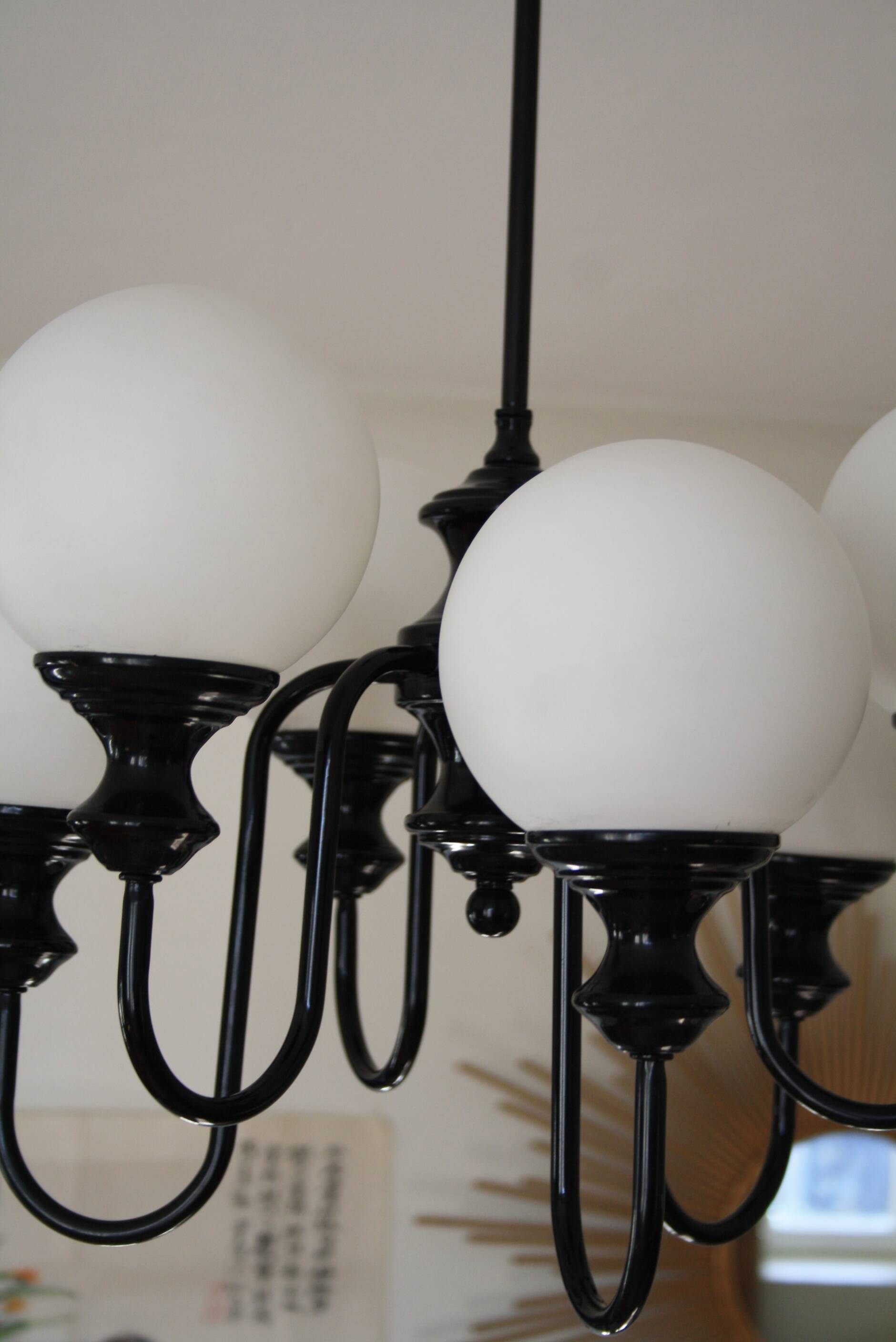 Metal chandelier and glass globes