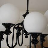 Metal chandelier and glass globes